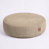 Khaki PupSak dog bed in a home setting